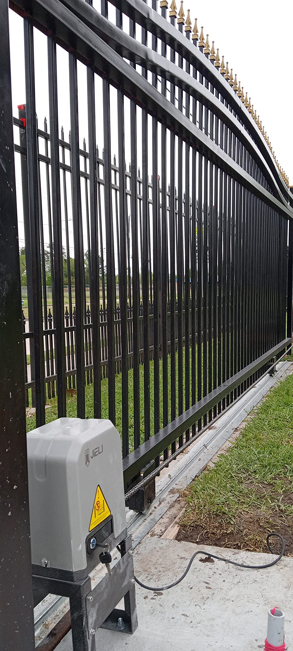 Jieli sliding gate opener installed on residential driveway gate
